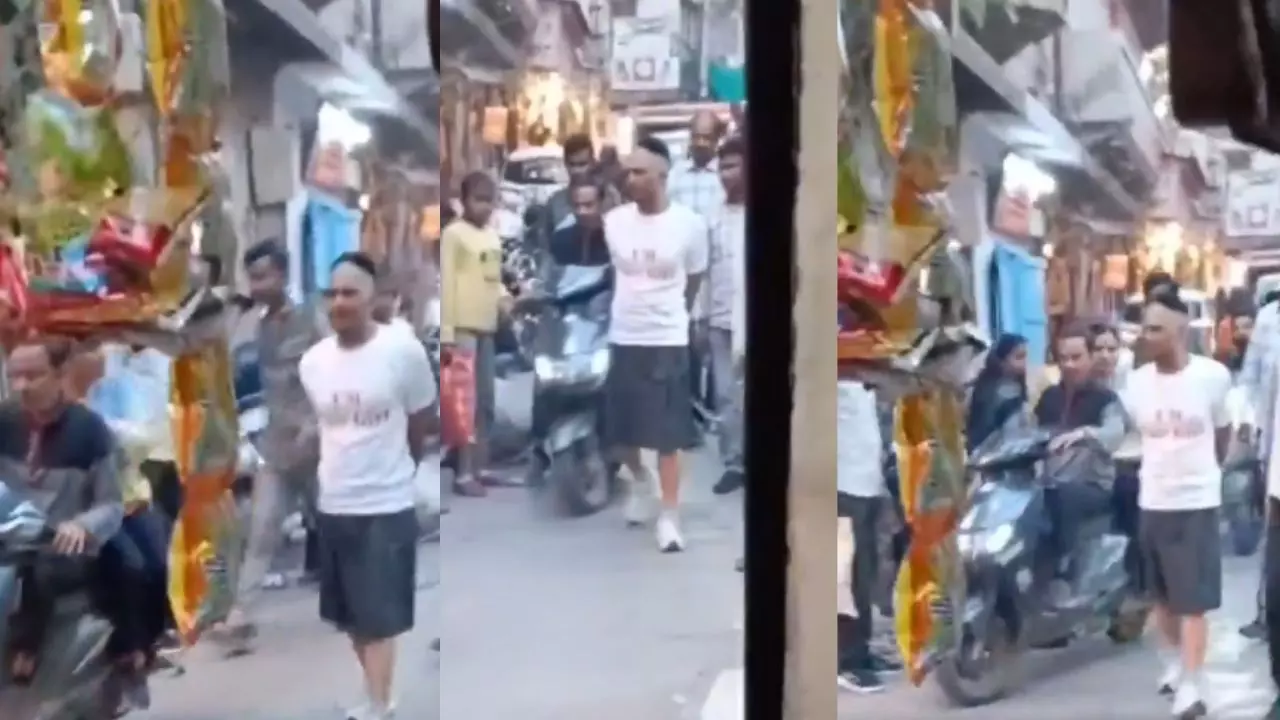 हाथ में हथकड़ी और स्कर्ट पहनाकर बाजार में बदमाश को लेकर निकली पुलिस, VIDEO वायरल