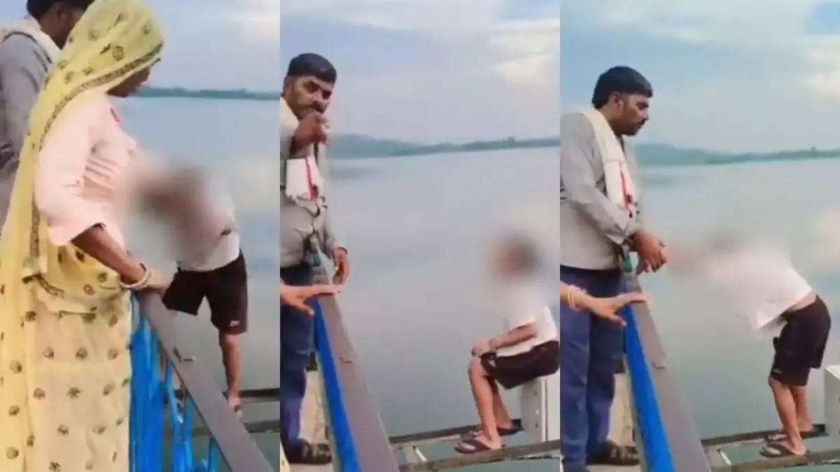 लाइक्स के लिए लाइफ खतरे में! वायरल होने के चक्कर में बच्ची को डैम की रेलिंग से लटकाया, वीडियो देख माता-पिता पर भड़के लोग लाइक्स के लिए लाइफ खतरे में! वायरल होने के चक्कर में बच्ची को डैम की रेलिंग से लटकाया, वीडियो देख माता-पिता पर भड़के लोग