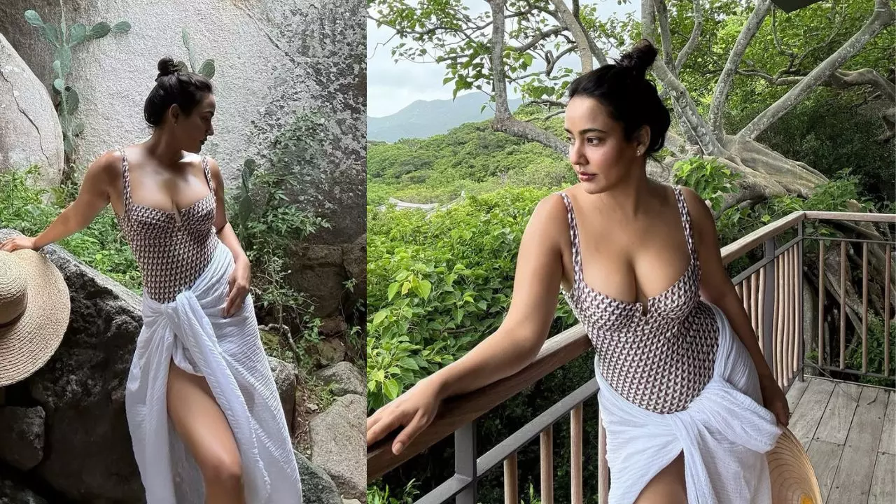 Neha Sharma का किलर वेकेशन लुक, टोन्ड फिगर और बन हेयरस्टाइल देख फैंस हुए बेकाबू