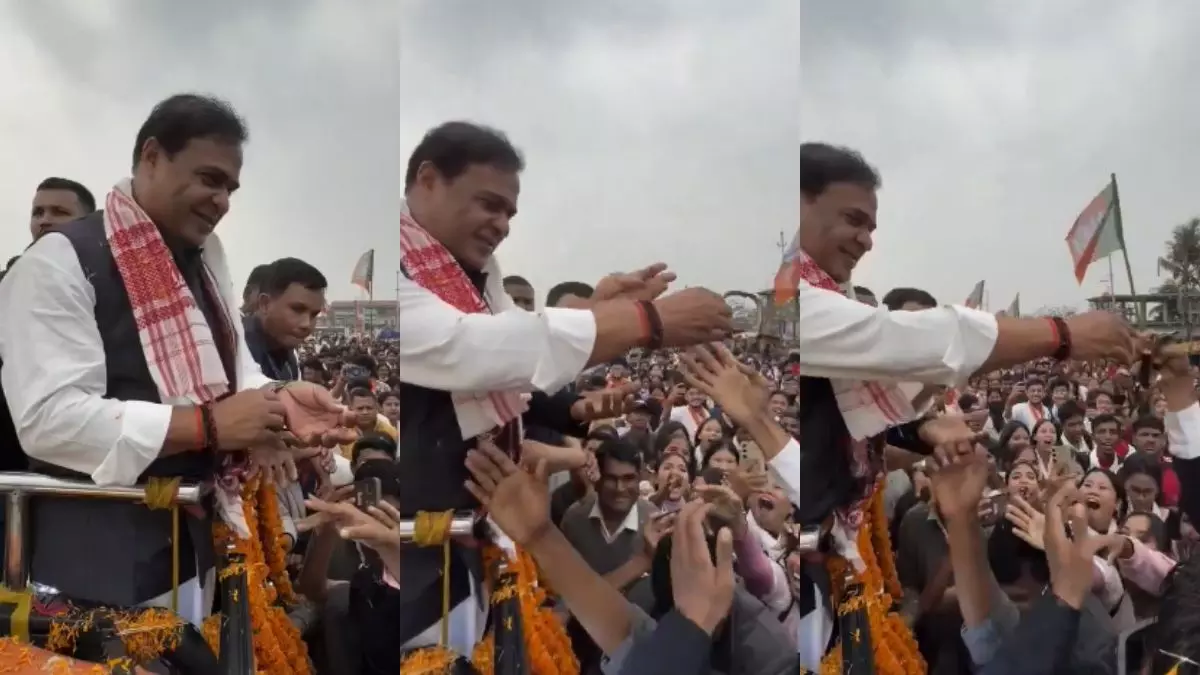 assam cm sarma  gifts watch to student